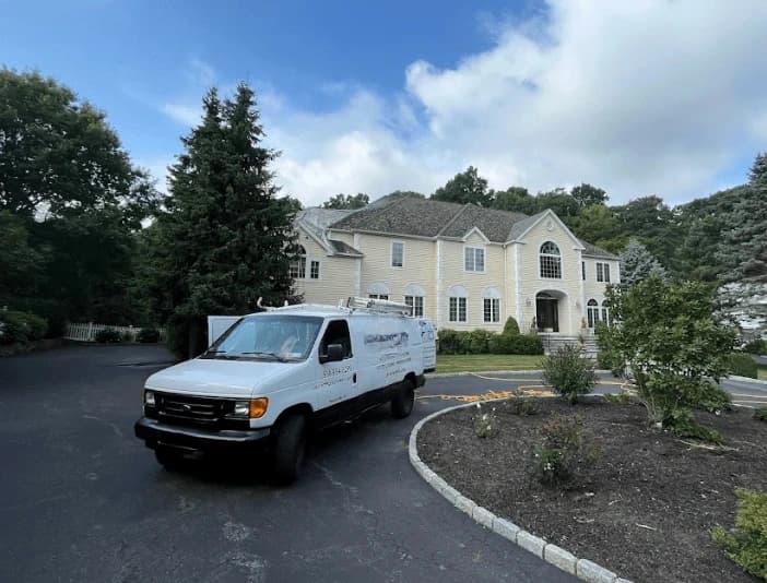 Euclid Power Washing technician performing thorough gutter cleaning service in Euclid